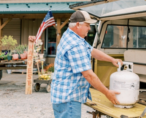 man with propane cylinder tank
