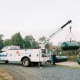 Euliss worker lifting propane tank with crane