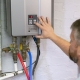 technician adjusting tankless water heaters