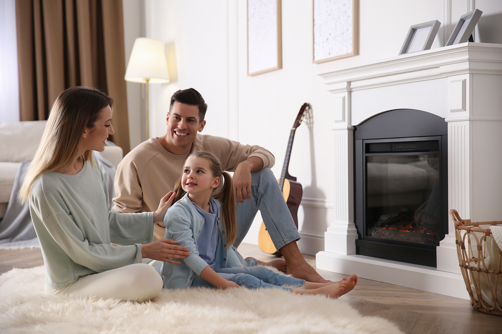 Happy Family Resting Near Fireplace At Home