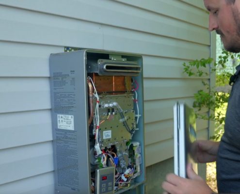 Euliss technician servicing tankless water heater