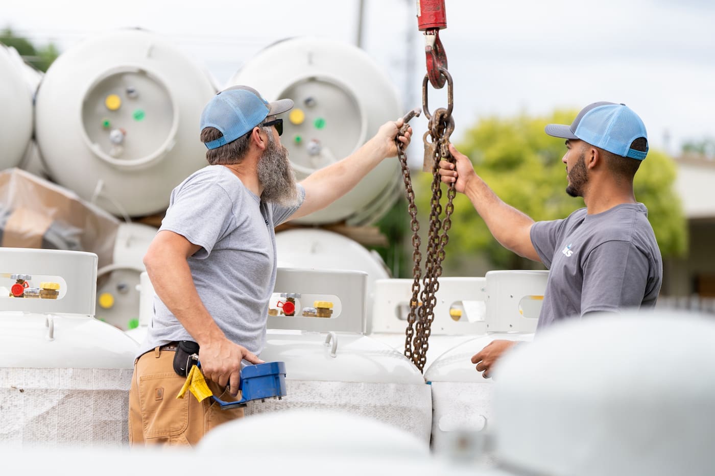 Euliss technicians with propane tanks