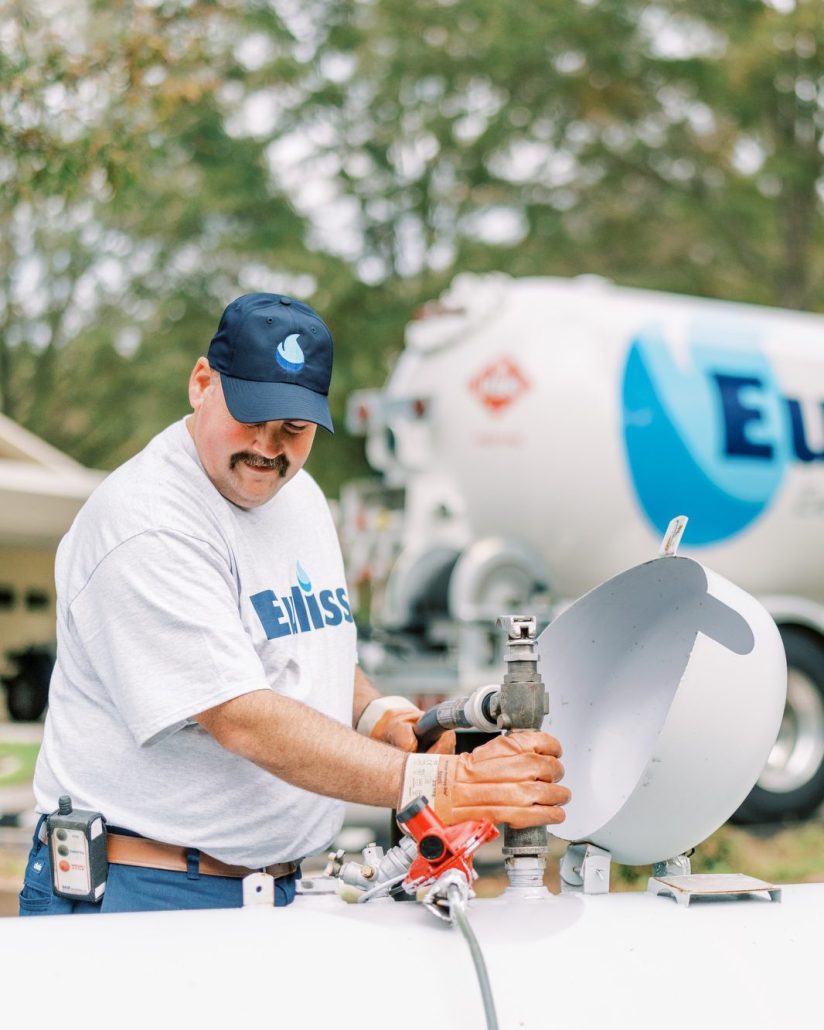 Euliss technician filling a tank with a propane refill.