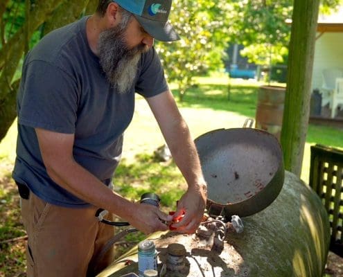 Euliss technician performing a safety gas check on a propane tank.