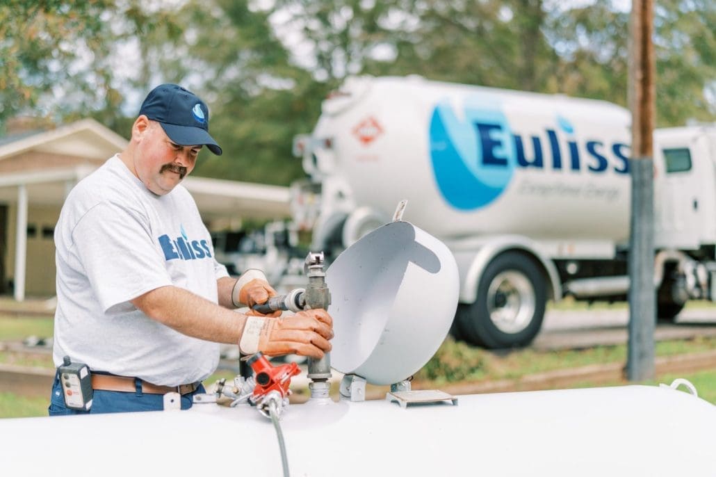 Stephen Smith, one of Euliss's propane delivery drivers filling up a propane tank.