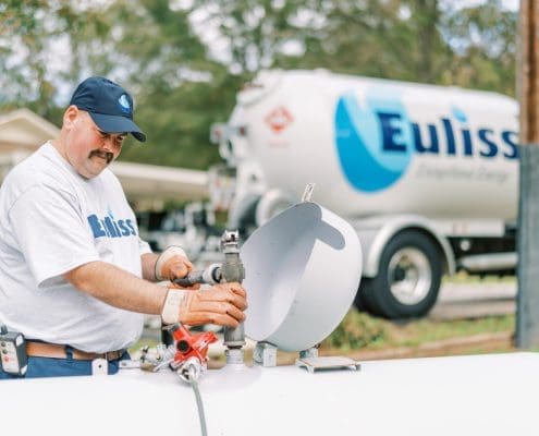 Stephen Smith, one of Euliss's propane delivery drivers filling up a propane tank.